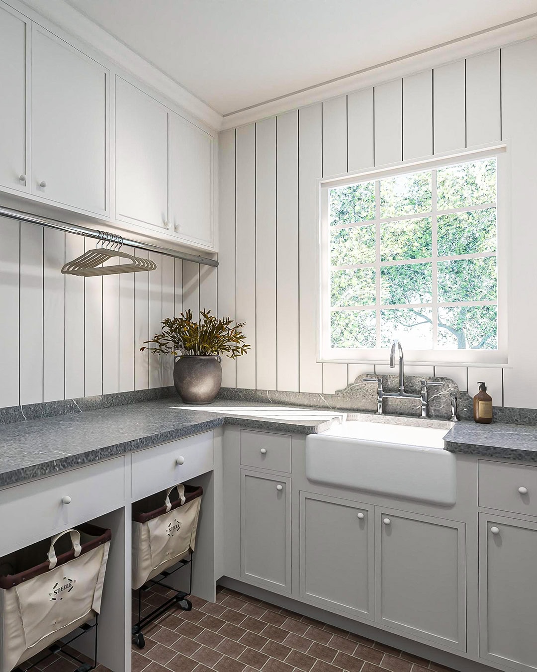 Painted cabinet hardware and polished nickel fixtures in custom new build laundry room