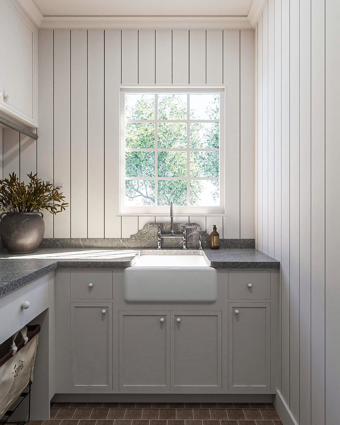 French country custom new build laundry room with inset cabinetry and vertical wall paneling