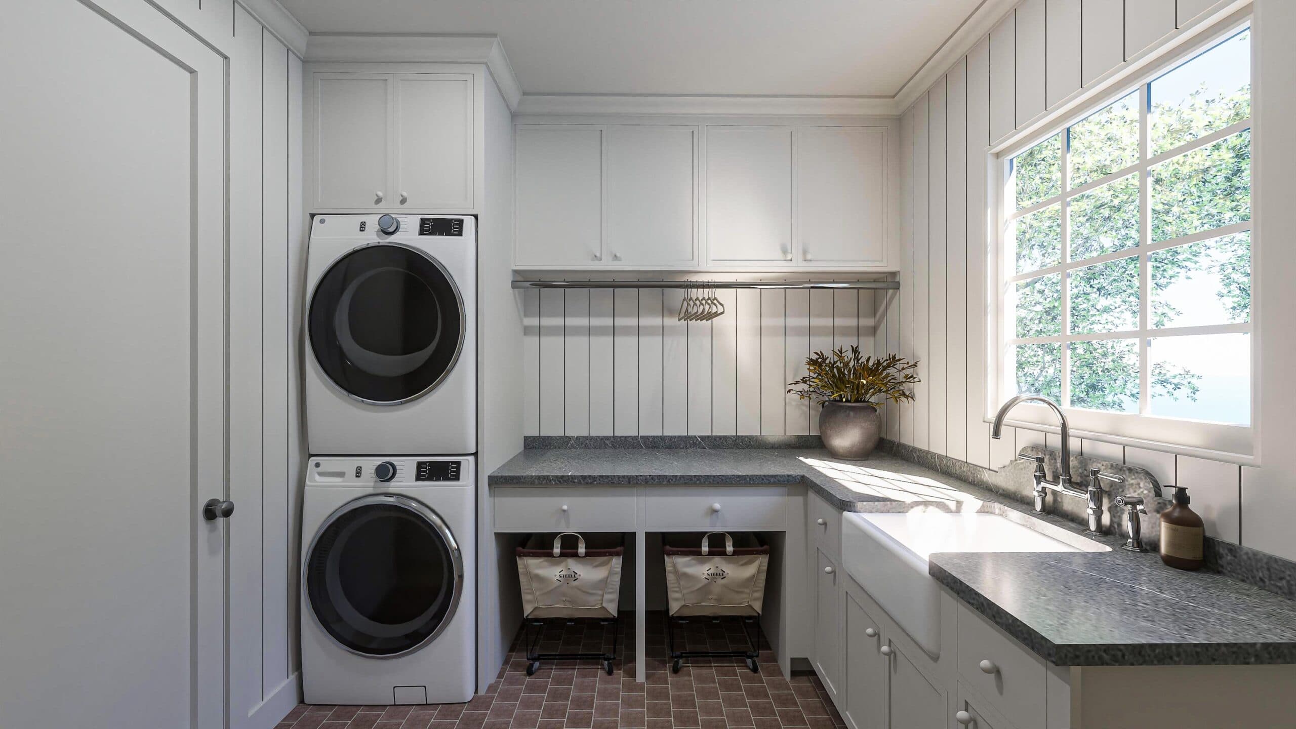 Soapstone countertop and decorative backsplash in custom new build laundry room with terracotta floors, stacked washer and dryer, and polished nickel finishes