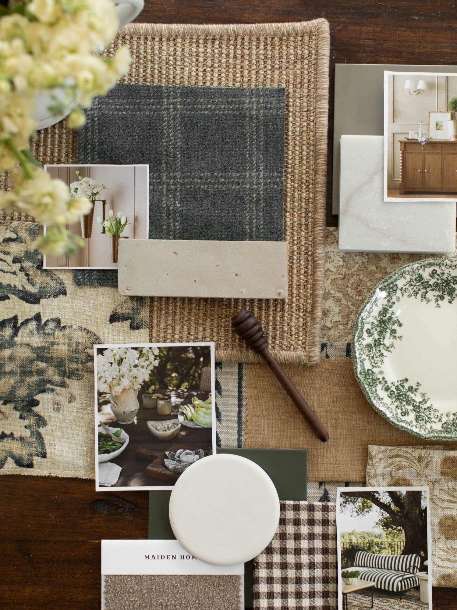 Interior design material palette with fabric, stone, finishes, and inspiration images during design development.